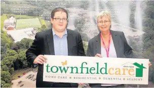  ??  ?? John Timmins, director at Townfield Care, and Charlotte Scheffmann, assistant principal at Accrington and Rossendale College