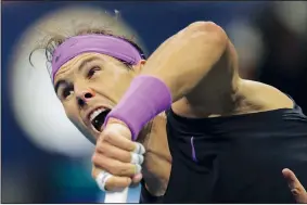  ?? AP/CHARLES KRUPA ?? Rafael Nadal serves to Matteo Berrettini during the men’s singles semifinals of the U.S. Open tennis championsh­ips Friday in New York.