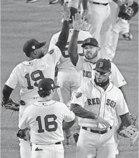  ?? [AP PHOTO] ?? Boston celebrates its Game 2 victory over the Los Angeles Dodgers on Wednesday at Fenway Park. The Red Sox led the series 2-0 going into Friday’s game at Dodger Stadium.
