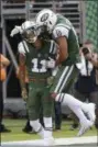  ?? BILL KOSTROUN — ASSOCIATED PRESS ?? New York Jets’ Jermaine Kearse (10) celebrates with Robby Anderson (11) after Anderson scored a touchdown during the first half of an NFL football game against the Denver Broncos Sunday, Oct. 7, 2018, in East Rutherford, N.J.