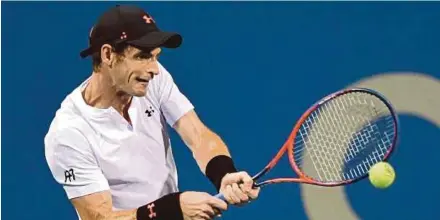  ??  ?? Andy Murray returns a backhand to Mackenzie McDonald during their match at the Rock Creek Tennis Center in Washington on Monday. AFP PIC