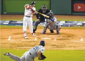  ?? Elise Amendola / Associated Press ?? Boston left fielder Andrew Benintendi singles off Dodgers starter Clayton Kershaw in the first inning to drive in the game’s first run. Benintendi was 3-for-3 against Kershaw and 4-for-5 in the game.