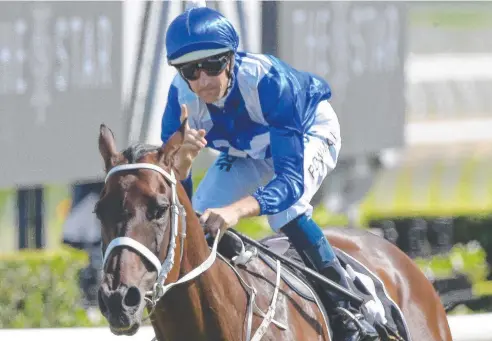  ??  ?? EASY WIN: Jockey Hugh Bowman riding Winx to victory in the Star Apollo Stakes on Saturday at Royal Randwick.