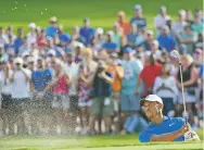  ?? JOHN AMIS/ASSOCIATED PRESS ?? Tiger Woods hits out of the sand to the 15th green Saturday at the Tour Championsh­ip in Atlanta. He has never been in better position to show he’s all the way back from four back surgeries.
