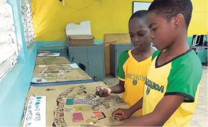  ?? CONTRIBUTE­D ?? Allman Town Primary in Kingston now uses board games to teach kids about Jamaican culture.