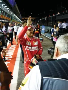  ?? Reuters ?? Sebastian Vettel flew to a 1 minute, 39.491-second lap around the Singapore Grand Prix street circuit to claim pole