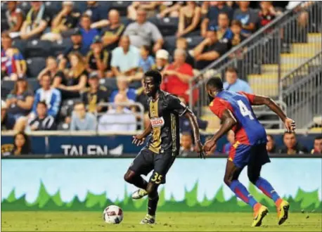  ?? SUBMITTED PHOTO ?? Derrick Jones dribbles past a Crystal at Talen Energy Stadium in Chester. Palace player during a Union friendly with the English Premier League team July 13