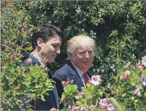  ?? CP PHOTO/SEAN KILPATRICK ?? Prime Minister Justin Trudeau and U.S. President Donald Trump walk together during the G7 Summit in Taormina, Italy, on Saturday.