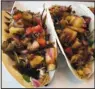  ?? Arkansas Democrat-Gazette/ ERIC E. HARRISON ?? A house-made pineapple salsa dominates the Fish Tacos at The Main Cheese in west Little Rock.