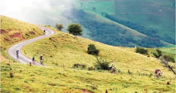  ??  ?? Photo shows cyclists make their way up the Col d’Ahusquy during the first day of the 2016 Haute Route Pyrenees timed cycling event in France.