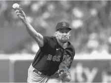  ?? TONY GUTIERREZ/AP ?? Red Sox starting pitcher Nate Eovaldi throws against the Astros during the first inning of Game 2 of the ALCS on Saturday in Houston.