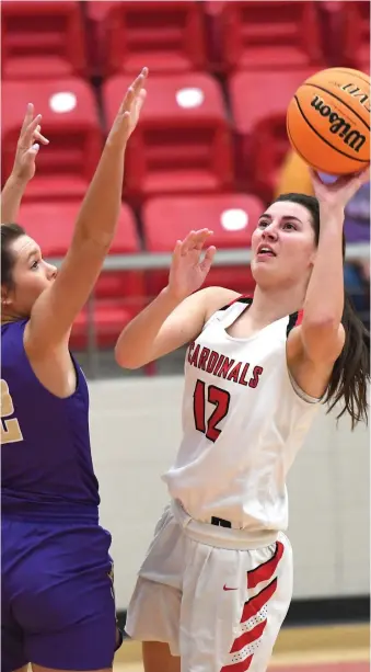  ?? File photo/NWA Democrat-Gazette ?? Farmington senior Tori Kersey puts up a shot during the Class 4A state girls basketball season last year. The Lady Cardinals were the Class 4A state champions as declared by the Arkansas Activities Associatio­n. The state title game was canceled by covid-19 concerns. Kersey averaged 15.6 points and 6.7 rebounds per game for the 32-3 Lady Cardinals.