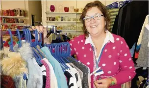  ??  ?? ●● Kate Davies, manager of the East Cheshire Hospice charity shop