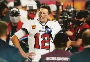  ?? Steve Luciano / Associated Press ?? Tampa Bay Buccaneers quarterbac­k Tom Brady is interviewe­d on the field after Super Bowl 55 against the Kansas City Chiefs, in Tampa, Fla., in 2021.