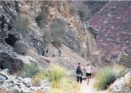  ?? Gina Ferazzi Los Angeles Times ?? HIKERS in the San Gabriel Mountains in October. Interior Secretary Ryan Zinke is reviewing the area’s designatio­n as a national monument.