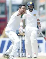  ?? — AFP ?? Bangladesh’s Subashis Roy (L) makes an unsuccessf­ul appeal against Sri Lanka’s Kusal Mendis.