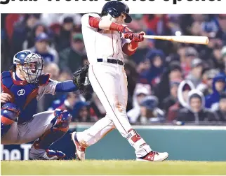  ?? BOB DECHIARA-USA TODAY SPORTS ?? BOSTON RED SOX outfielder Andrew Benintendi hits a double against the Los Angeles Dodgers in the seventh inning in game one of the 2018 World Series at Fenway Park.