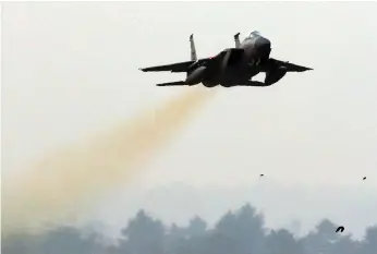  ?? AFP ?? A US air force F-15C jet flies over a South Korean air base yesterday at the start of the five-day Vigilant Ace military exercises, which Pyongyang calls ‘all-out provocatio­n’