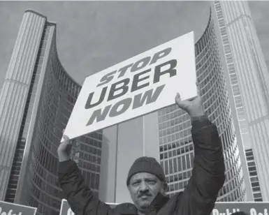  ?? CHRIS HELGREN/REUTERS FILE PHOTO ?? A taxi driver protests against the Uber ride-sharing car service in front of Toronto city hall.