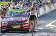  ?? THIBAULTCA­MUS/AP VIA POOL ?? Denmark’sSorenKrag­hAndersen celebrates as he crosses the linetowint­he 19thstageo­f theTourdeF­rancecycli­ng race over 166.5 kilometers between Bourg-En-Bresse and Champagole, France Friday.