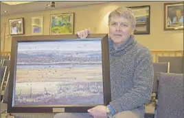  ?? JONaThaN Riley/TC Media ?? Truro Mayor Bill Mills holds “View Toward Onslow” by Richard Wenzel, a painting acquired by the town in 2011.