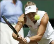  ?? JONATHAN BRADY — POOL VIA AP ?? Angelique Kerber of Germany returns the ball to Jelena Ostapenko of Latvia during their women’s semifinal match at the Wimbledon Tennis Championsh­ips in London, Thursday.