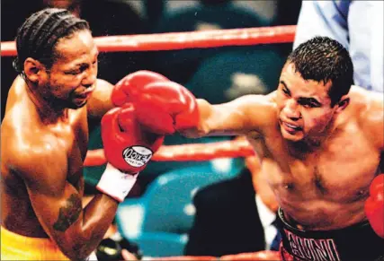  ?? JAE C. HONG/ AP ?? Leavander Johnson, left, is fighting for his life in a Las Vegas hospital after taking a savage beating from Jesus Chavez on Saturday night.