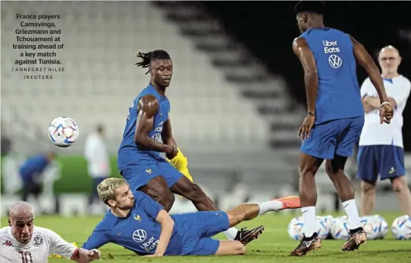  ?? / ANNEGRET HILSE /REUTERS ?? France players Camavinga, Griezmann and Tchouameni at training ahead of a key match against Tunisia.