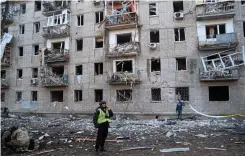  ?? ?? A block of flats in Kharkiv hit by a Russian missile on Wednesday
