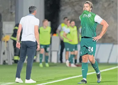  ??  ?? Darren Mcgregor heads for the tunnel in Rijeka, while manager Jack Ross reorganise­s his defence