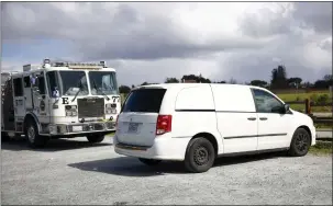  ?? SHAE HAMMOND — STAFF PHOTOGRAPH­ER ?? A coroner's van visits Rancho San Antonio Open Space, near Cupertino on March 5. A woman who was killed while hiking in the area has been identified.