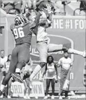  ??  ?? A FAKE field goal by Memphis failed when UCLA’s Octavius Spencer (18) intercepte­d a pass in end zone.
