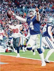  ?? Mike Ehrmann/TNS ?? Dak Prescott of the Dallas Cowboys rushes for a touchdown against the Tampa Bay Buccaneers during the second quarter in the NFC wild-card playoff game at Raymond James Stadium last Sunday in Tampa, Fla.