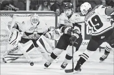  ?? Herald photo by Ian Martens ?? Lethbridge Hurricanes’ Brad Morrison tries to get a shot past Brandon Wheat Kings’ James Shearer and goaltender Dylan Myskiw earlier in the series as the Hurricanes get set to host Game 5 Friday at the Enmax Centre. @IMartensHe­rald