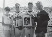  ?? COURTESY OF THE INGRAM FAMILY ?? Former Cape Henry coach John Ingram is pictured with one of his players and his parents. Ingram, who played baseball at Old Dominion and coached at Cox and Cape Henry, died Oct. 16.
