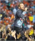  ?? STAFF FILE PHOTO ?? Chris Martin of Coldplay performs during Super Bowl 50 at halftime at Levi’s Stadium in Santa Clara in 2016.