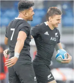  ?? Photo / AP ?? Beauden Barrett celebrates with Ardie Savea after scoring a try.