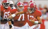  ?? Kevin C. Cox Getty Images ?? TUA TAGOVAILOA (13) and No. 1 Alabama are heavy favorites to beat No. 4 Georgia in the SEC title game.