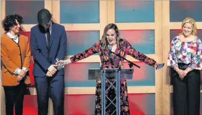  ?? TIM KROCHAK /THE CHRONICLE HERALD ?? Kinley Dowling of Charlottet­own accepts the Rising Star Recording of the Year Award during the 2018 ECMAs in Halifax Thursday night. She also picked up an ECMA for fans choice video of the year for “Microphone”.