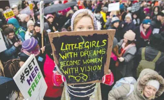  ?? CHRIS J RATCLIFFE/GETTY IMAGES ?? Protests around the world, including this #Timesup rally in England in 2018, have brought attention to the social movements that marked the past decade.