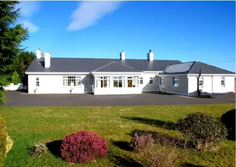  ??  ?? The five bedroom bungalow on 10ac near Crossmolin­a sold for €245,000 at a keenly contested auction