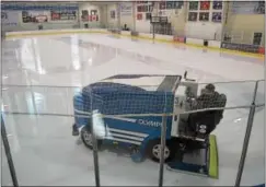  ?? PETE BANNAN — DIGITAL FIRST MEDIA ?? Cleaning the playing surface at Ice Line. The hockey complex has added the new Goal Line Pub and Restaurant overlookin­g one of the rinks.