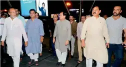  ?? — PTI ?? Congress leaders Bharatsinh Solanki, Arjun Modhwadia, Ahmed Patel at Ahmedabad airport to receive the party’s MLAs from Karnataka on Monday.