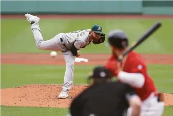  ?? Paul Rutherford / Getty Images ?? A’s starter Paul Blackburn stranded eight Red Sox baserunner­s in the first four innings of a 4-3 win at Fenway Park. He allowed one run in 51⁄3 innings and lowered his ERA to 2.26.