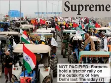  ??  ?? NOT PACIFIED: Farmers hold a tractor rally on the outskirts of New Delhi last Thursday (7)