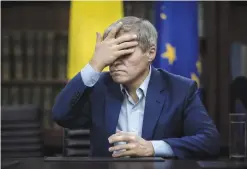  ??  ?? BUCHAREST: Romanian Prime Minister Dacian Ciolos touches his forehead during an interview with the Associated Press in Bucharest, Romania. —AP
