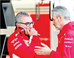  ?? — Reuters photo ?? Ferrari team principal Maurizio Arrivabene (right) in the pit lane before practice at Circuit of Monza in Italy.