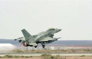  ?? Wam ?? An F-16 of the UAE Armed Forces taking off from an air force base in Jordan.