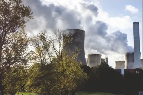  ?? MICHAEL PROBST /AP ?? STEAM RISES FROM THE COAL-FIRED POWER PLANT in Niederauss­em, Germany, on Nov. 2, 2022. The cause of global warming is showing no signs of slowing as heat-trapping carbon dioxide in Earth’s atmosphere increased to record highs in its annual Spring peak, jumping at one of the fastest rates on record, officials announced Monday.