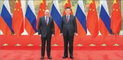  ?? LI TAO / XINHUA ?? President Xi Jinping meets with Russian President Vladimir Putin at the Diaoyutai State Guesthouse in Beijing on Feb 4.